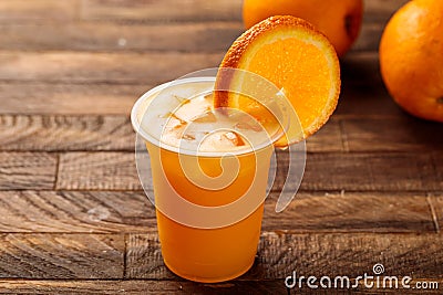 Frehs Orange juice with raw orange slice served in glass side view on wooden table morning meal Stock Photo
