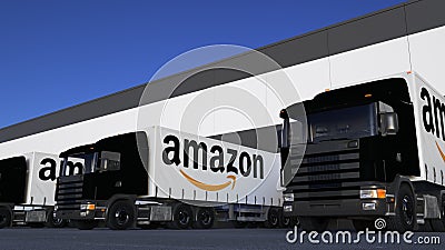 Freight semi trucks with Amazon.com logo loading or unloading at warehouse dock. Editorial 3D rendering Editorial Stock Photo