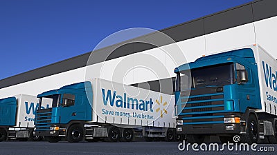 Freight semi trucks with Walmart logo loading or unloading at warehouse dock. Editorial 3D rendering Editorial Stock Photo