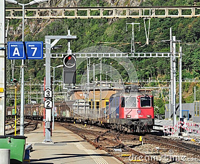 Freight Train at Brig Station Editorial Stock Photo