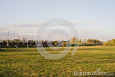 A freight train with tanks moves by rail Stock Photo