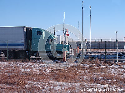 Freight truck stands on the China-Russian border. Editorial Stock Photo