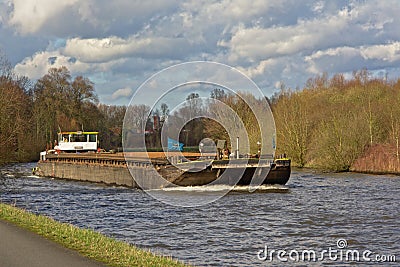 Freighter on river scheldt, flanders Editorial Stock Photo