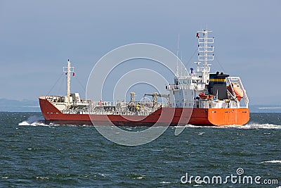 Freighter sailing towards Northsea at Firth of Forth near Edinburgh Stock Photo