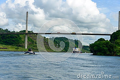 Freighter and tug approaching Centennial bridge Editorial Stock Photo