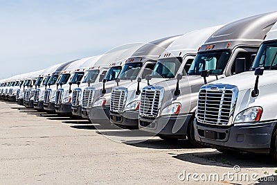 Freightliner Semi Tractor Trailer Trucks Lined up for Sale. Freightliner is owned by Daimler AG III Editorial Stock Photo