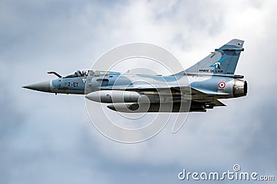 French Air Force Dassault Mirage 2000 fighter jet plane in flight over Florennes Air Base, Belgium - June 15, 2017 Editorial Stock Photo