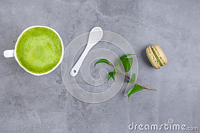 French almond cake makarons, green leaf, matcha tea Stock Photo