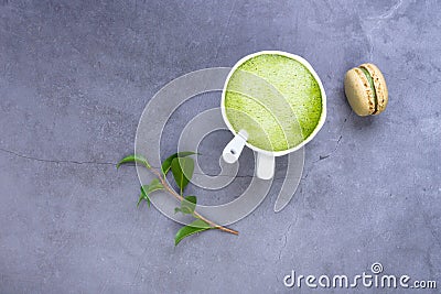 French almond cake makarons, green leaf, matcha tea Stock Photo