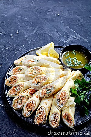 French appetizer: crepes with cheese and salmon Stock Photo