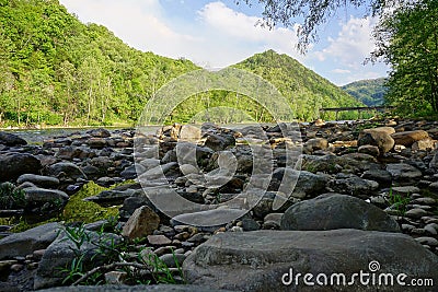 French Broad River with bridge in Appalachian Mountains near Hot Springs North Carolina Stock Photo