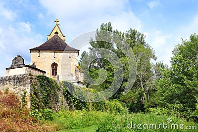 French chapel & cemetery on green hillside Stock Photo