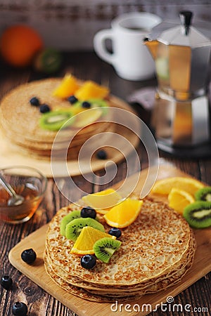 Crepes or bliny with fruits Stock Photo