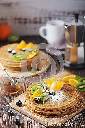 Crepes or bliny with fruits Stock Photo