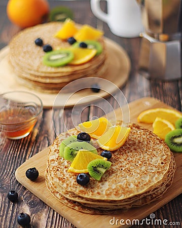 Crepes or bliny with fruits Stock Photo