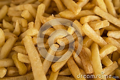 French fries fresh cooked. lots of potatoes fried. Street food, fast food. Potato fries closeup. Stock Photo