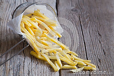 French fries in metal basket Stock Photo