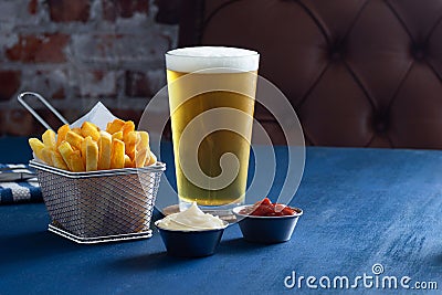 French Fries with Pilsner or Lager Beer, Mayonnaise and Ketchup Stock Photo