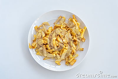 French fries on a plate, isolated on white background Stock Photo