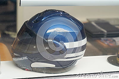 French gendarmerie motorcycle helmet in windows recruiting office Editorial Stock Photo