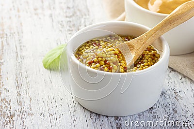 French grain mustard in a bowl. Stock Photo