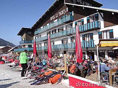 French holiday skiers relax at an outdoor restaurant Editorial Stock Photo