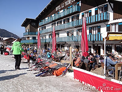 French holiday skiers relax at an outdoor restaurant Editorial Stock Photo