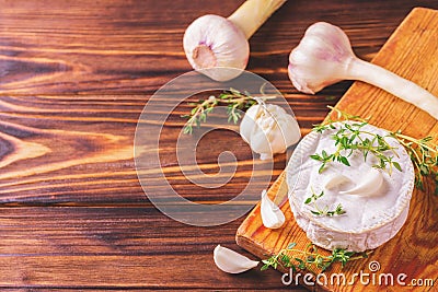 French homemade Camembert cheese with thyme and garlic Stock Photo