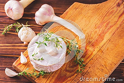 French homemade Camembert cheese with thyme and garlic Stock Photo