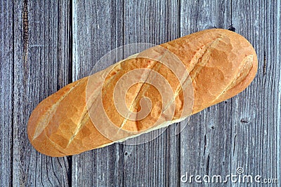 French loaf on rustic wood background flat lay Stock Photo