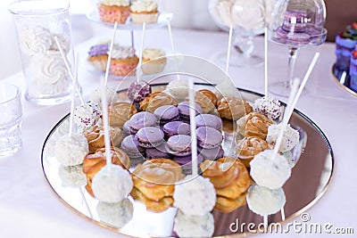 French macaroons cookies. Candy bar. A lot of sweets at the wedding banquet. Stock Photo