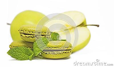 French macaroons and green apple, white background Stock Photo