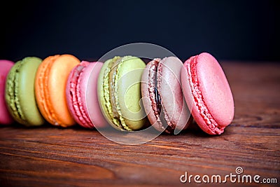 French macaroons and marshmellow in dark wooden background Stock Photo