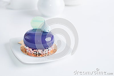 French mousse cake covered with violet glaze Stock Photo