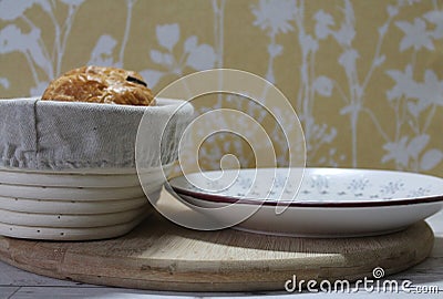 Pain au chocolat in a gray bread basket with a plate. Stock Photo