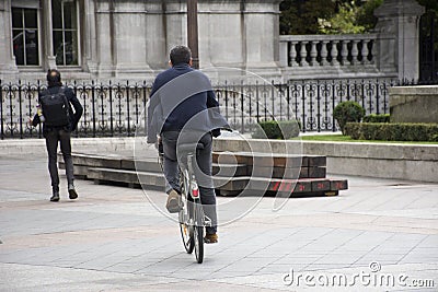 French people biking bicycle and walking at Courtyard Editorial Stock Photo