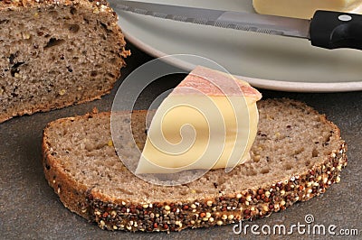 French Saint Nectaire cheese on bread Stock Photo