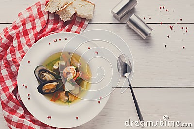 French seafood soup with white fish, shrimps and mussels in plat Stock Photo