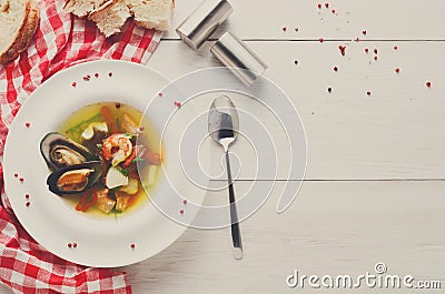 French seafood soup with white fish, shrimps and mussels in plat Stock Photo