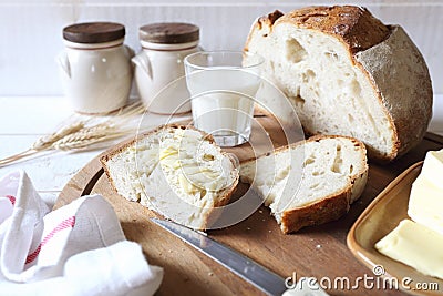 French sourdough bread, butter and glass of milk Stock Photo