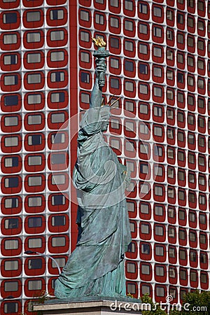 French Statue of Liberty Replica and modern buildings, Paris, France, AUGUST 1, 2015 - was given to Citizens of Paris in July 4, 1 Editorial Stock Photo