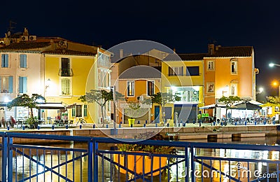 French town of Martigues overlooking buildings on bank of canal at dusk Stock Photo