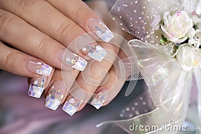 French wedding manicure with translucent glitters, white dots Stock Photo