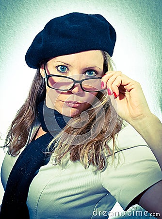 French woman pulling glasses down Stock Photo