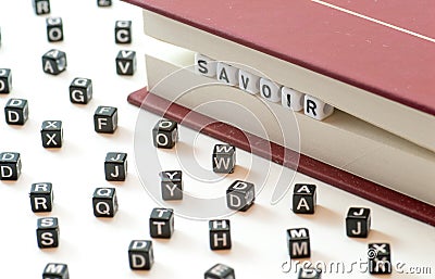 French word savoir meaning knowing written with letters trapped between a book files and spread letters on white background concep Stock Photo
