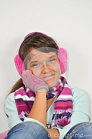 Frendly girl with ear muffs and trimmed gloves Stock Photo