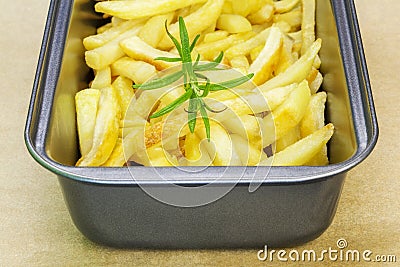 Frensh fries with rosemary in dish Stock Photo