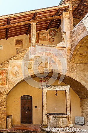 Fresco paintings on a staircase in an Italian courtyard Stock Photo