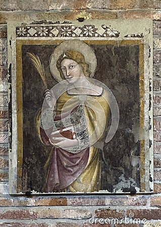 Fresco of Saint Agnes, Virgin and Christian Martyr, in the Church of the Martyrium, Basilica of Saint Stephen in Bologna, Italy. Editorial Stock Photo