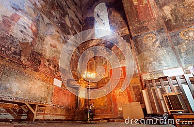 Fresco wall and candle lights inside the hall of Church of the Archangels, Georgia. Editorial Stock Photo